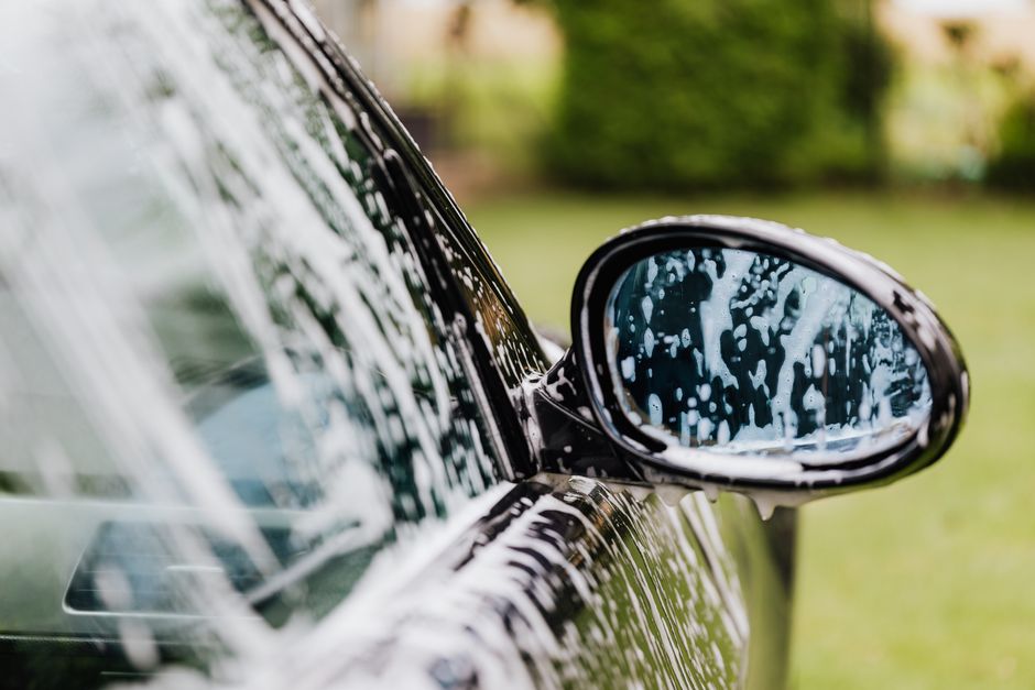 Thick foaming soap applied during a premium hand car wash