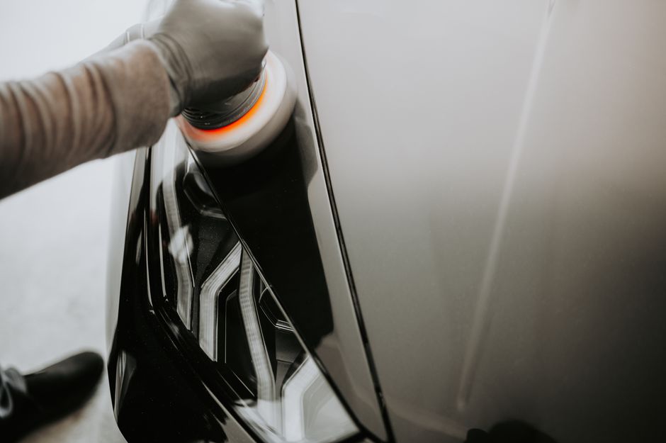 Applying protective wax to car paint for a lasting shine